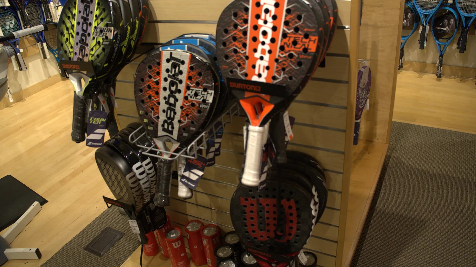 Babolat and Wilson padel rackets up close at the Mequon shop.