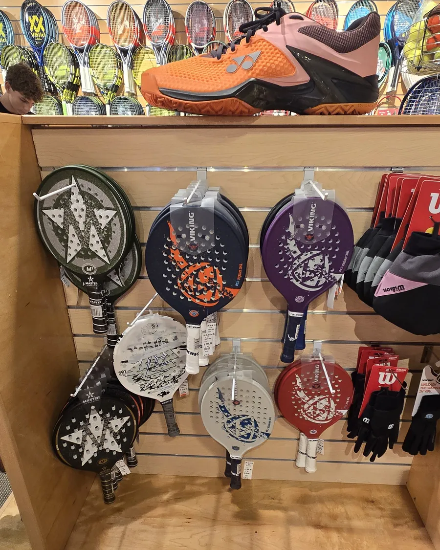 The platform tennis paddle endcap at the Mequon shop.