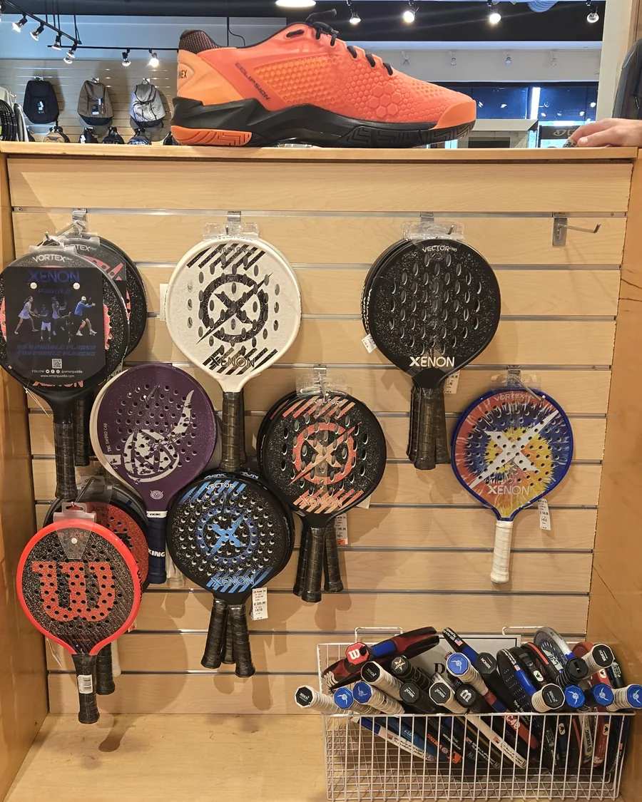 More platform tennis paddles on the rack at the Mequon shop.