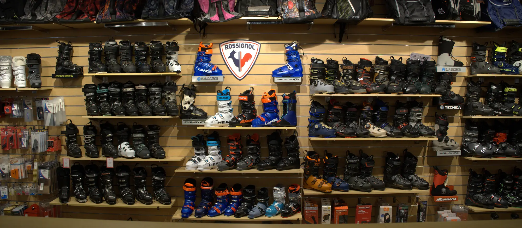 The full ski boot wall at the Mequon shop.