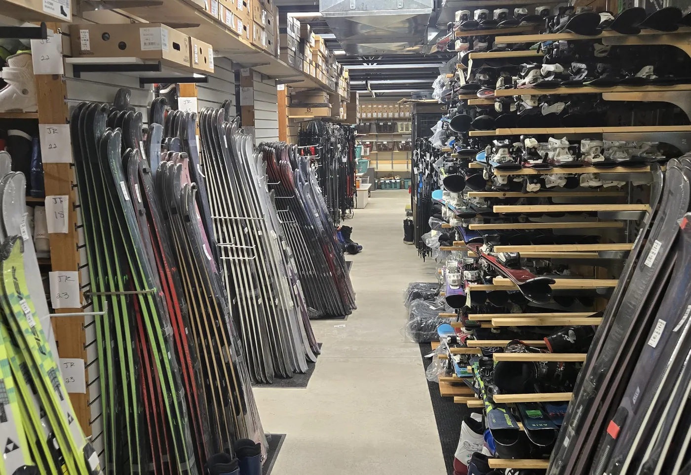 The season rental fleet racked downstairs at the Mequon shop.