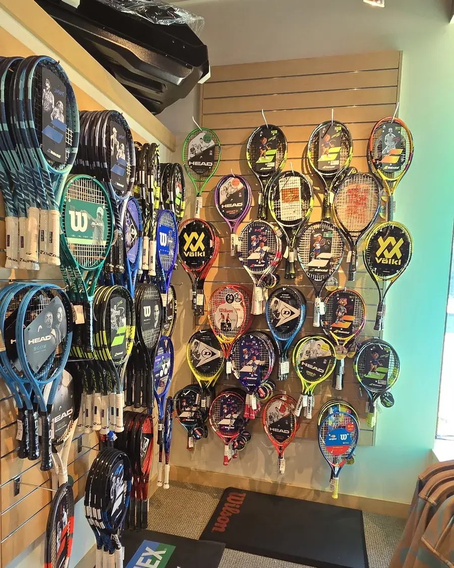The junior tennis racquet wall at the Mequon shop.