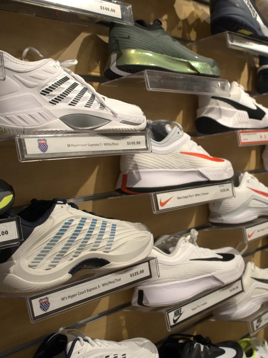 Court shoes on the display wall at the Mequon shop.
